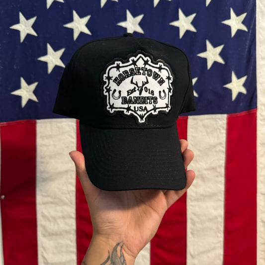01 HTB VARSITY TRUCKER - BLACK